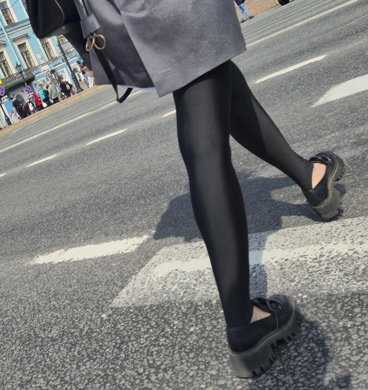 Girl in jacket and black leggins