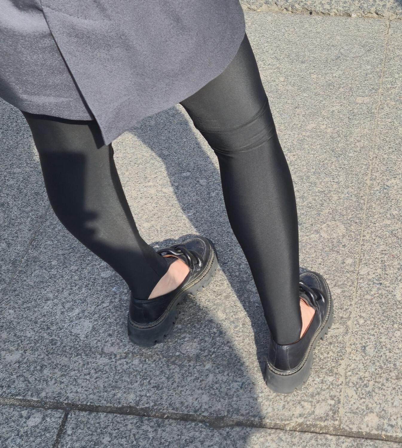 Girl in jacket and black leggins