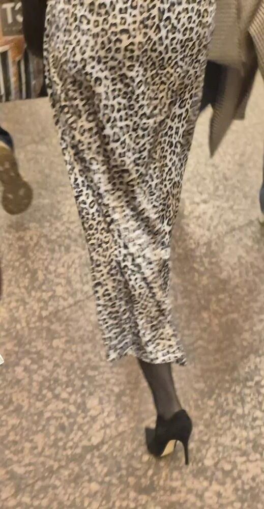Woman in long leopard print skirt