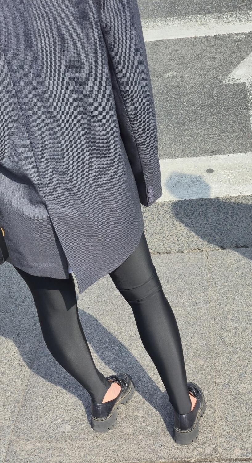 Girl in jacket and black leggins