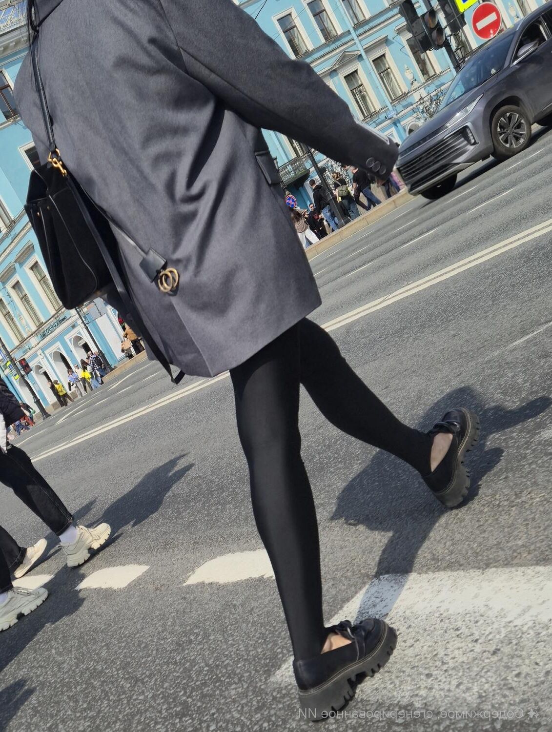 Girl in jacket and black leggins