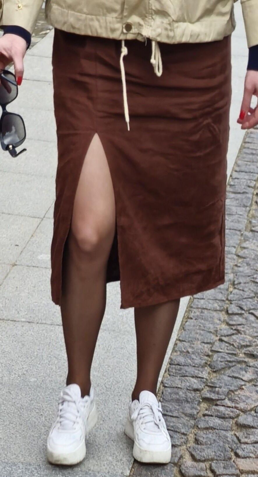 Girl in long skirt and brown pantyhose