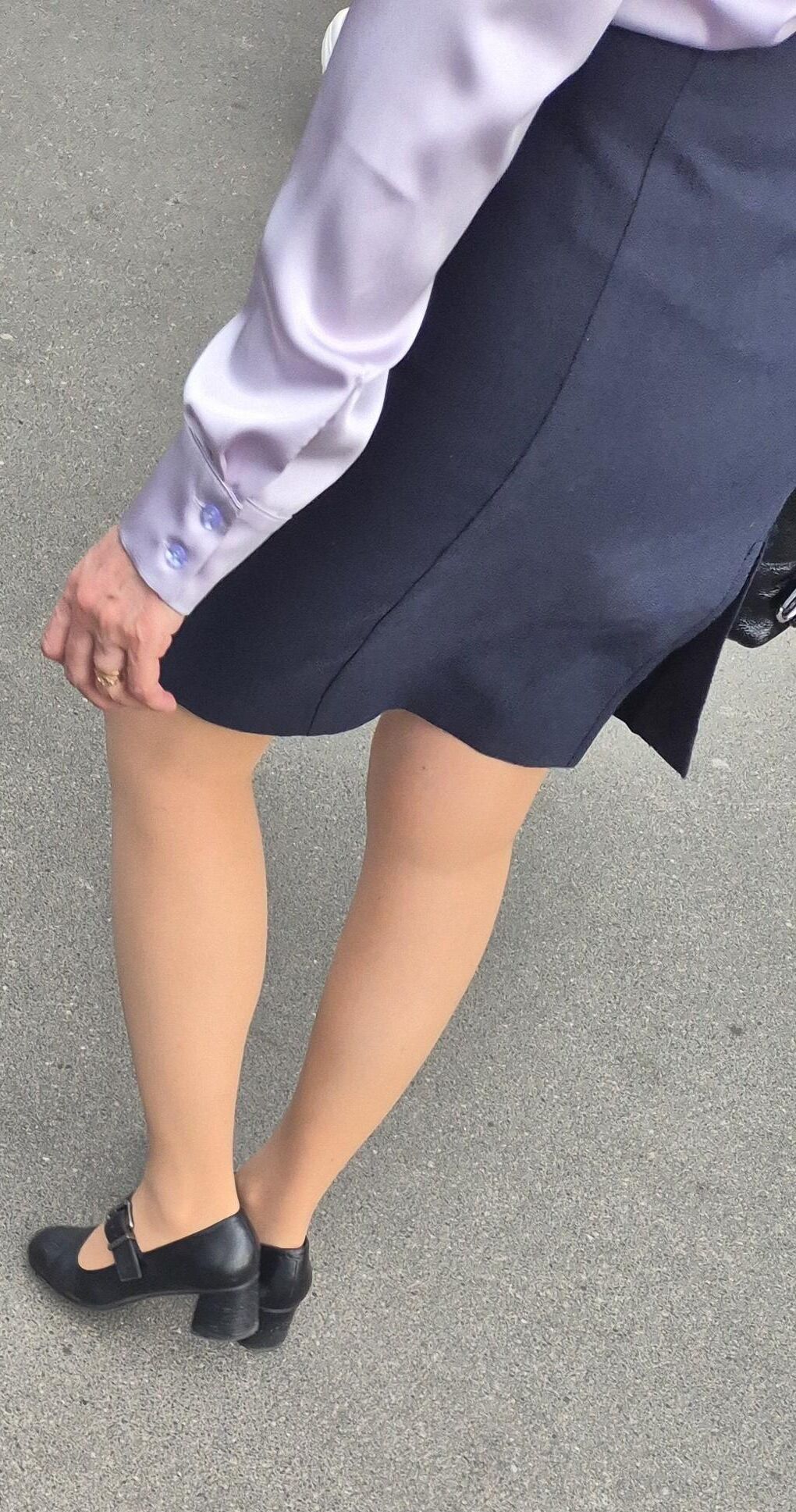 Woman in midi skirt and nude pantyhose