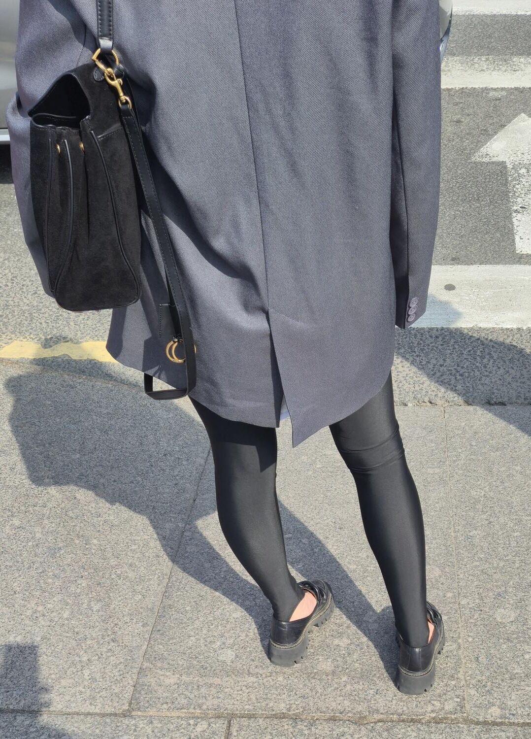 Girl in jacket and black leggins