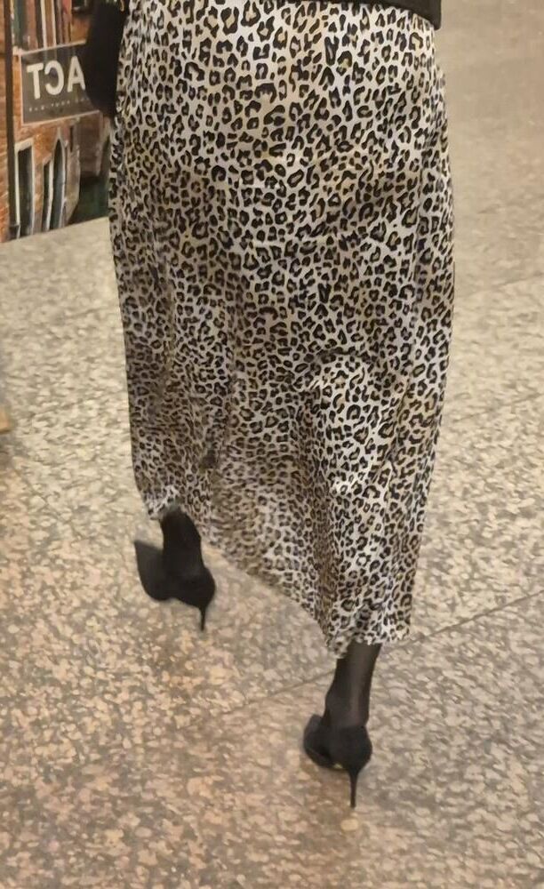 Woman in long leopard print skirt
