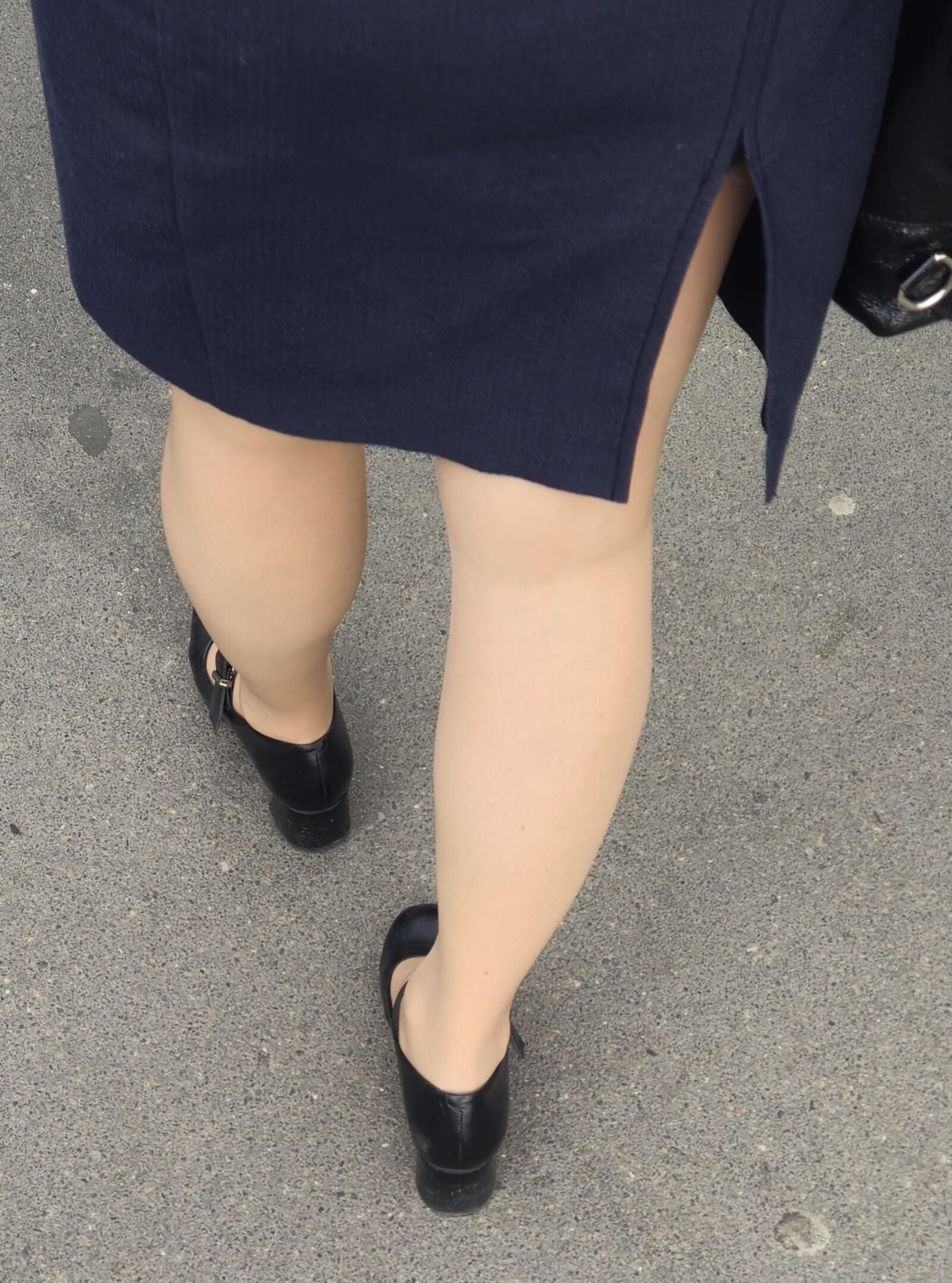 Woman in midi skirt and nude pantyhose