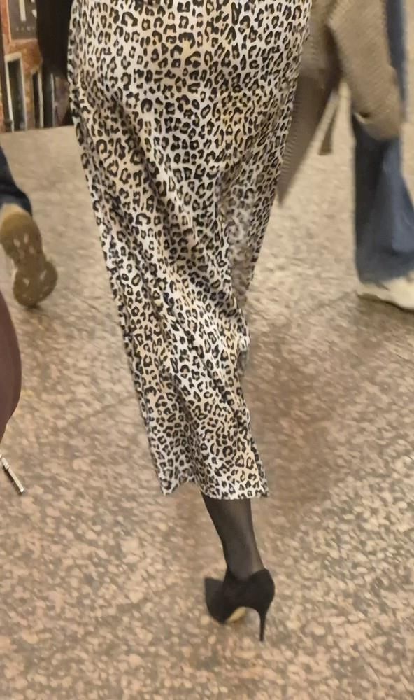 Woman in long leopard print skirt