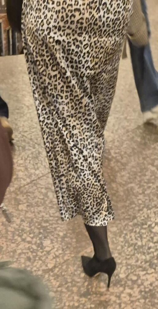 Woman in long leopard print skirt