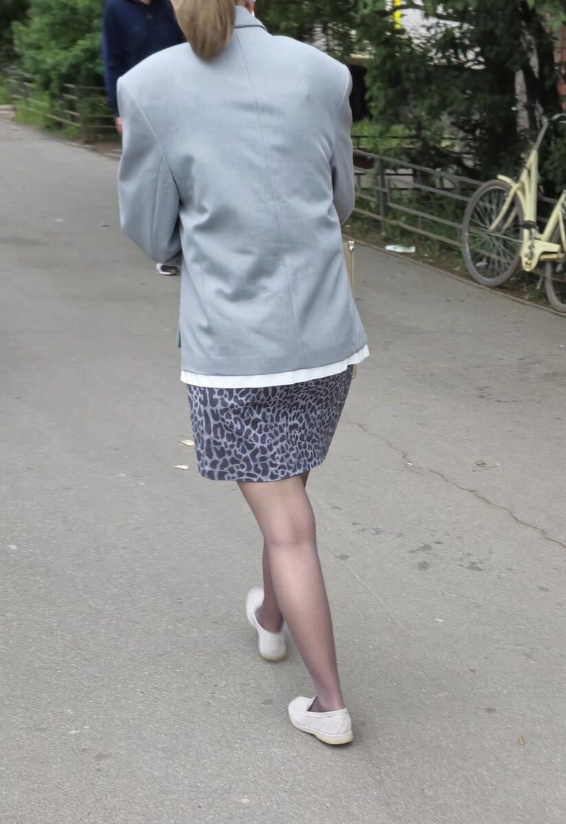 Woman in brown pantyhose and skirt