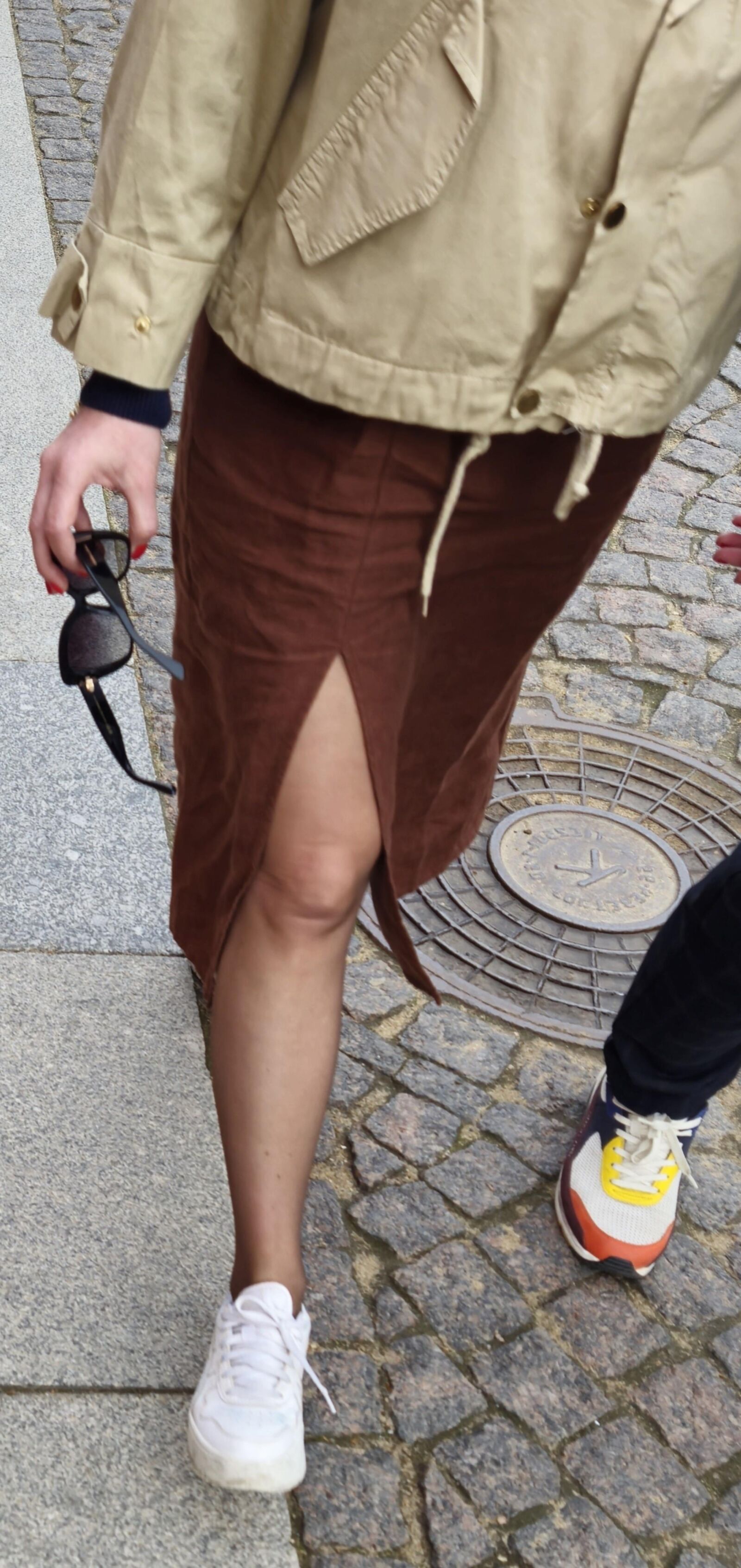 Girl in long skirt and brown pantyhose