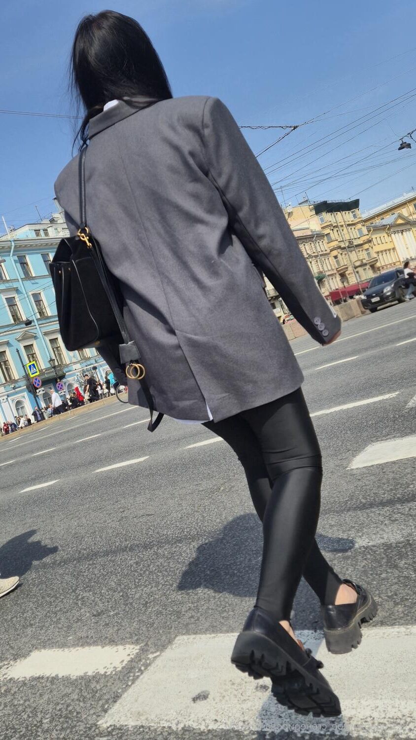 Girl in jacket and black leggins