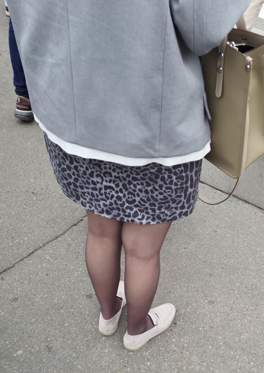Woman in brown pantyhose and skirt
