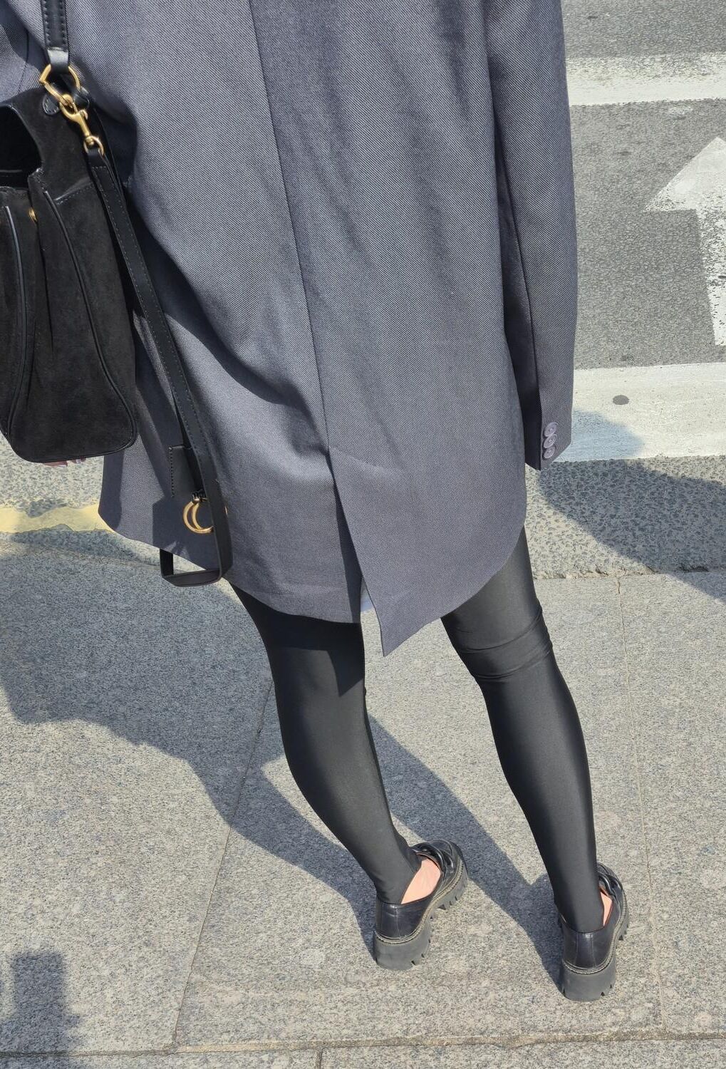 Girl in jacket and black leggins