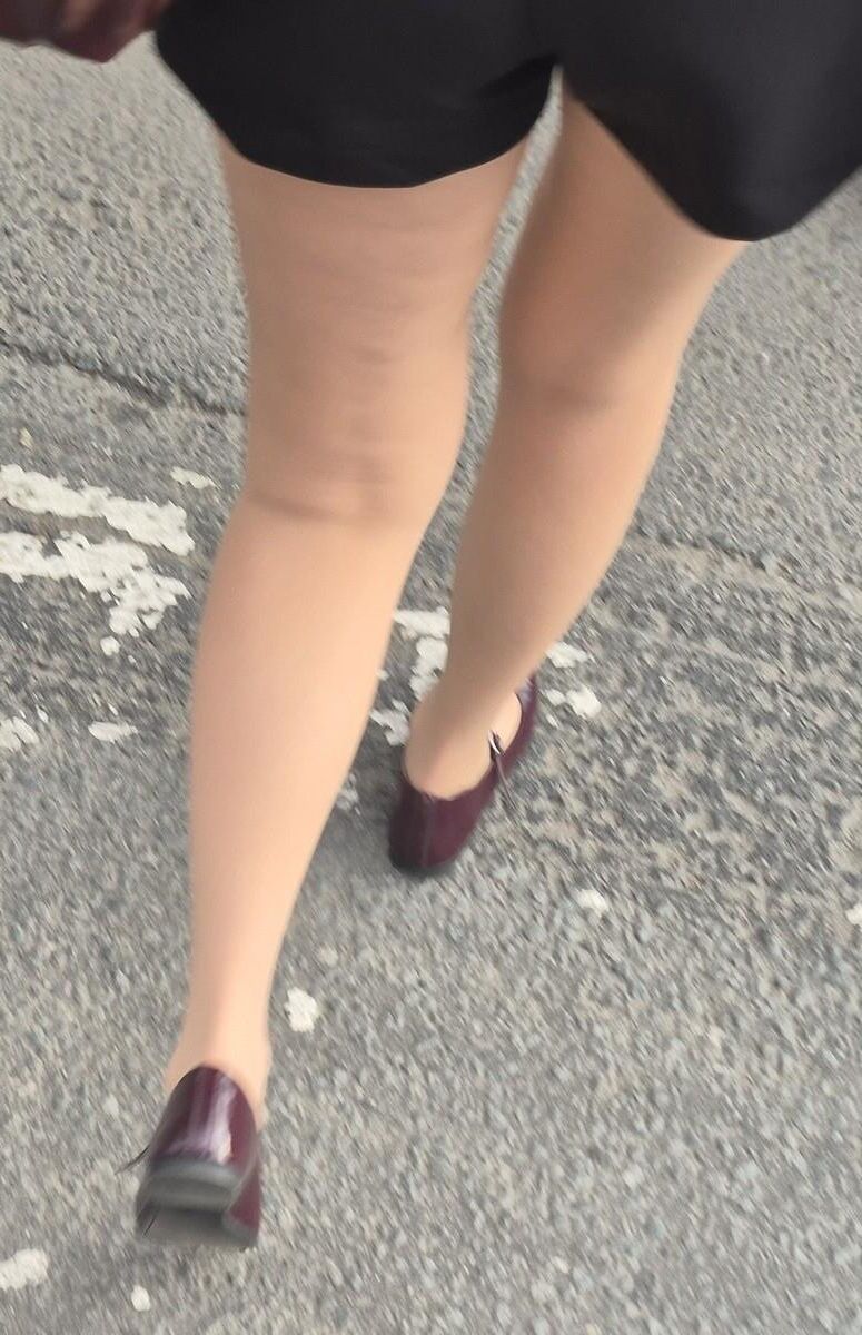 Girl in shorts, nude pantyhose and ballerinas shoes