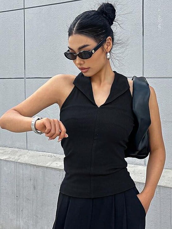 Black sleeveless tops and metal wristwatches #