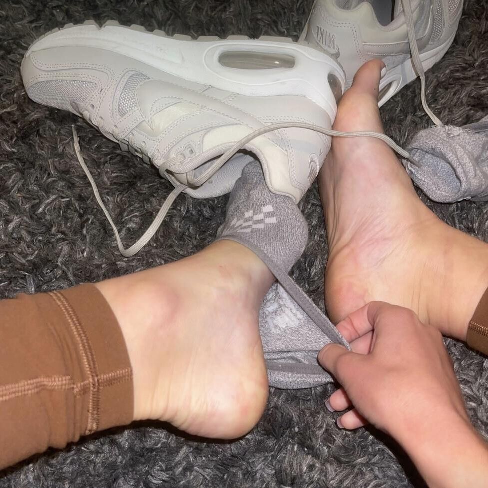 Kristin removing her sweaty shoes