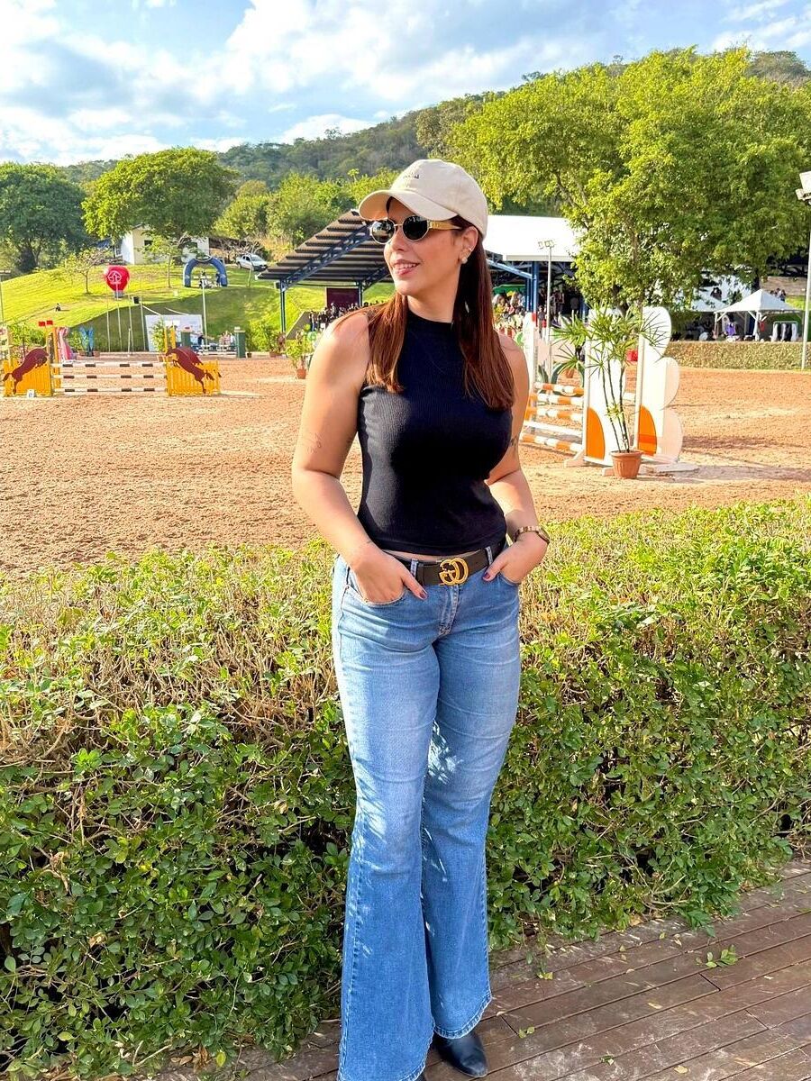 Black sleeveless tops and metal wristwatches #