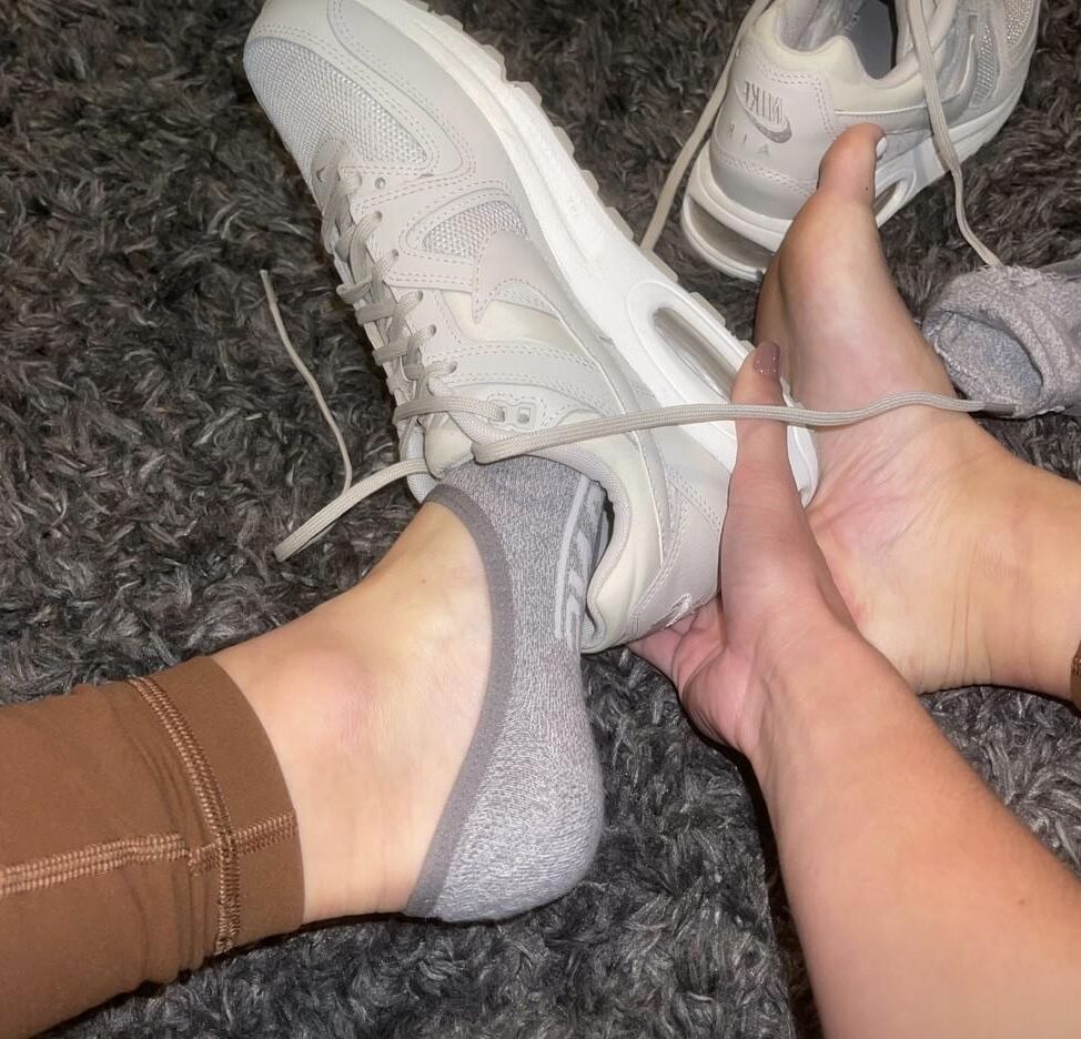 Kristin removing her sweaty shoes