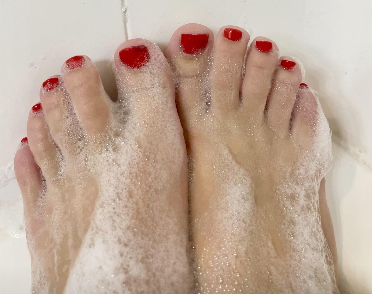 Kristin’s perfect, sexy, soapy red toes and hot soles