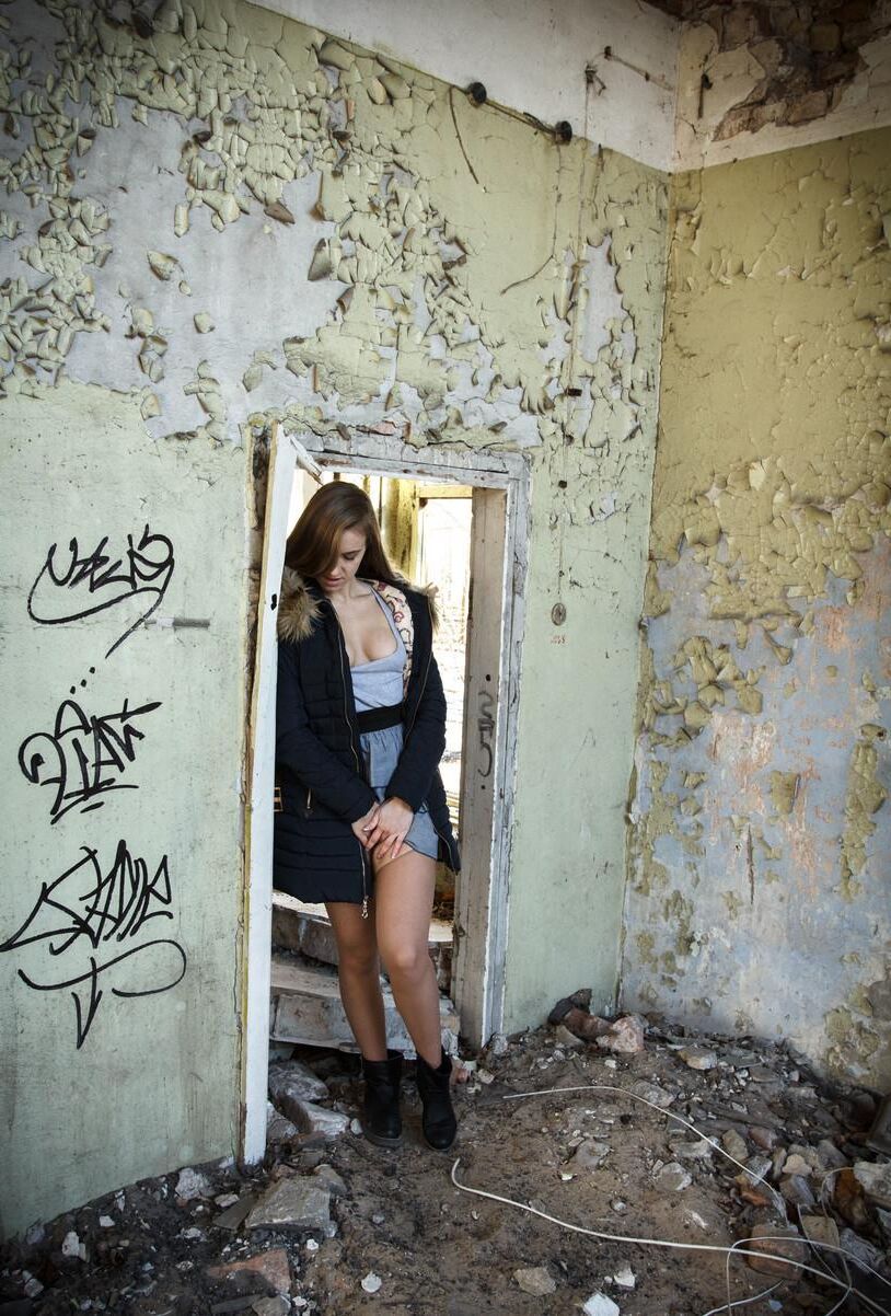 Posing next to the garbage