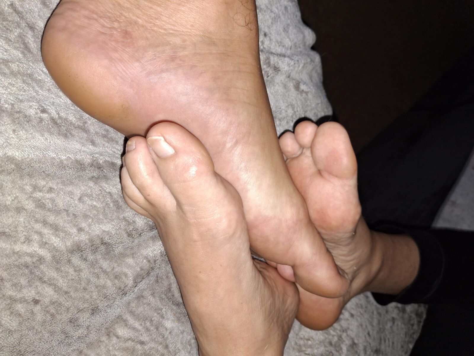 Playing Footsie barefoot with my girlfriend