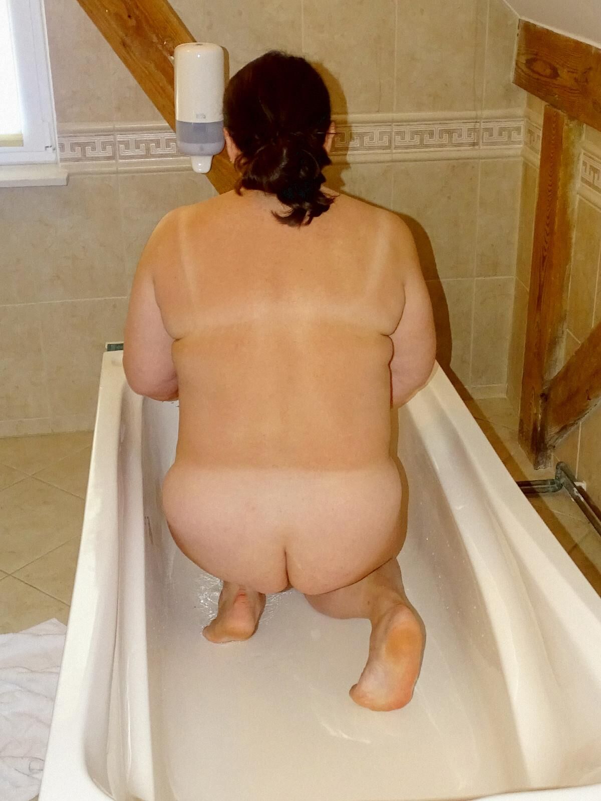 fat Anna with saggy tits naked in the bathroom