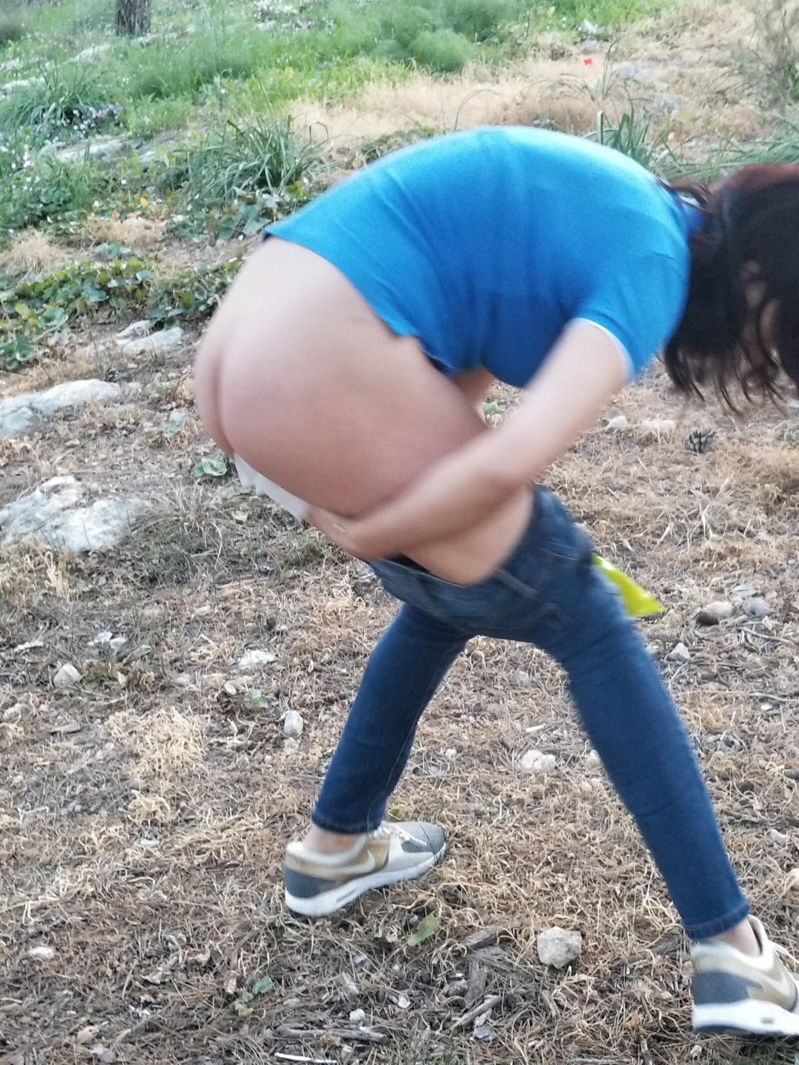 Yana pees in the forest