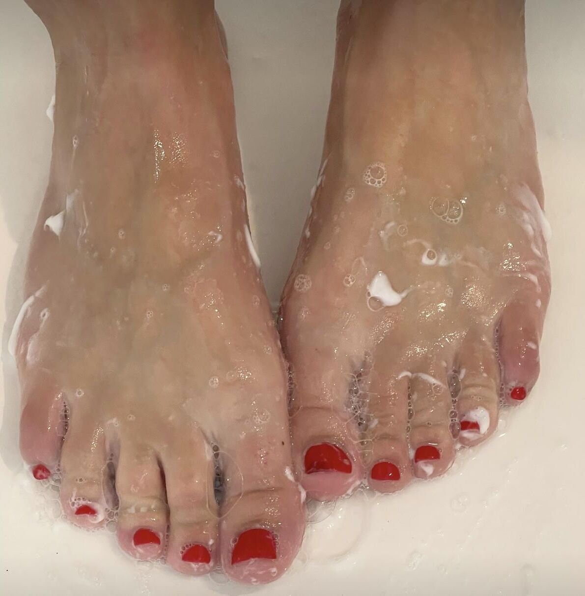 Kristin’s perfect, sexy, soapy red toes and hot soles