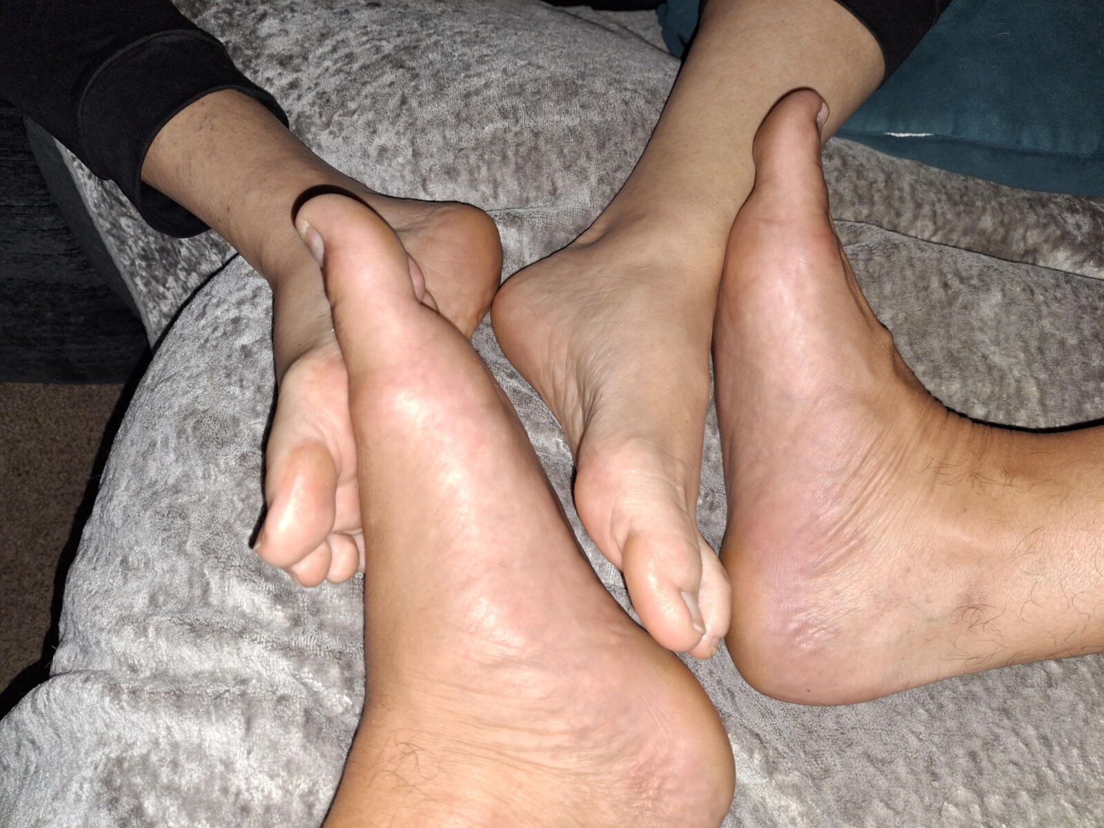 Playing Footsie barefoot with my girlfriend
