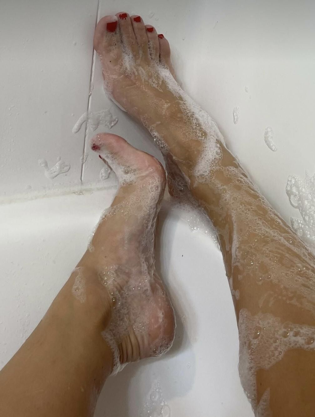Kristin’s perfect, sexy, soapy red toes and hot soles