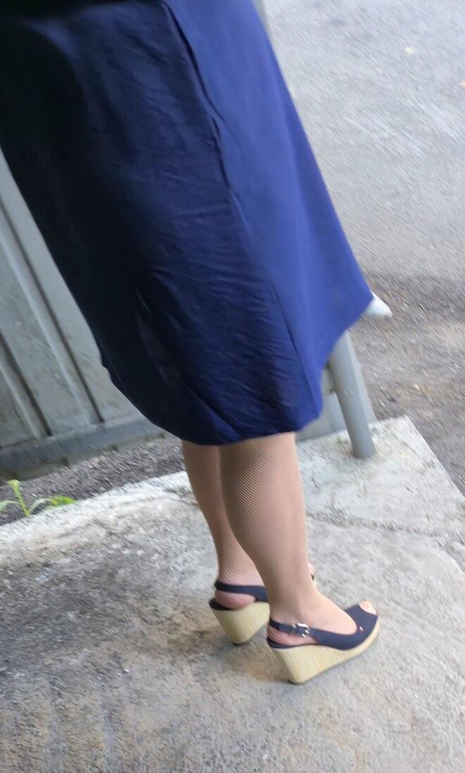 Co worker in fishnet pantyhose and wedges heels