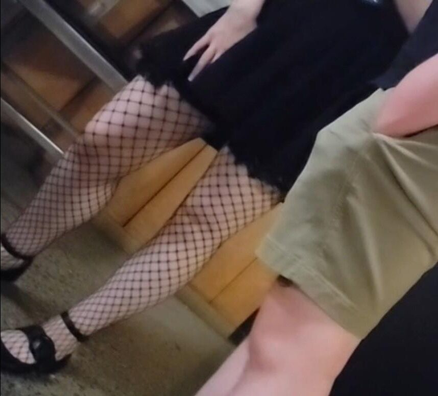 Candid skinny goth girl in fishnets on the street at night