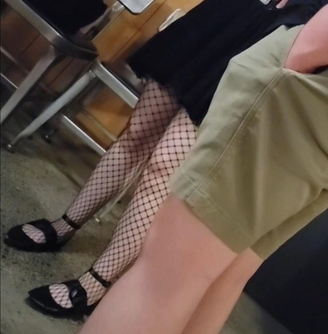 Candid skinny goth girl in fishnets on the street at night