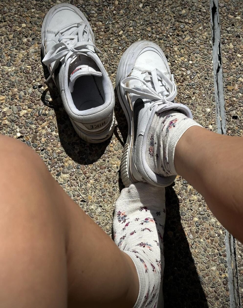 Kristin removes shoes and her sweaty, dirty socks