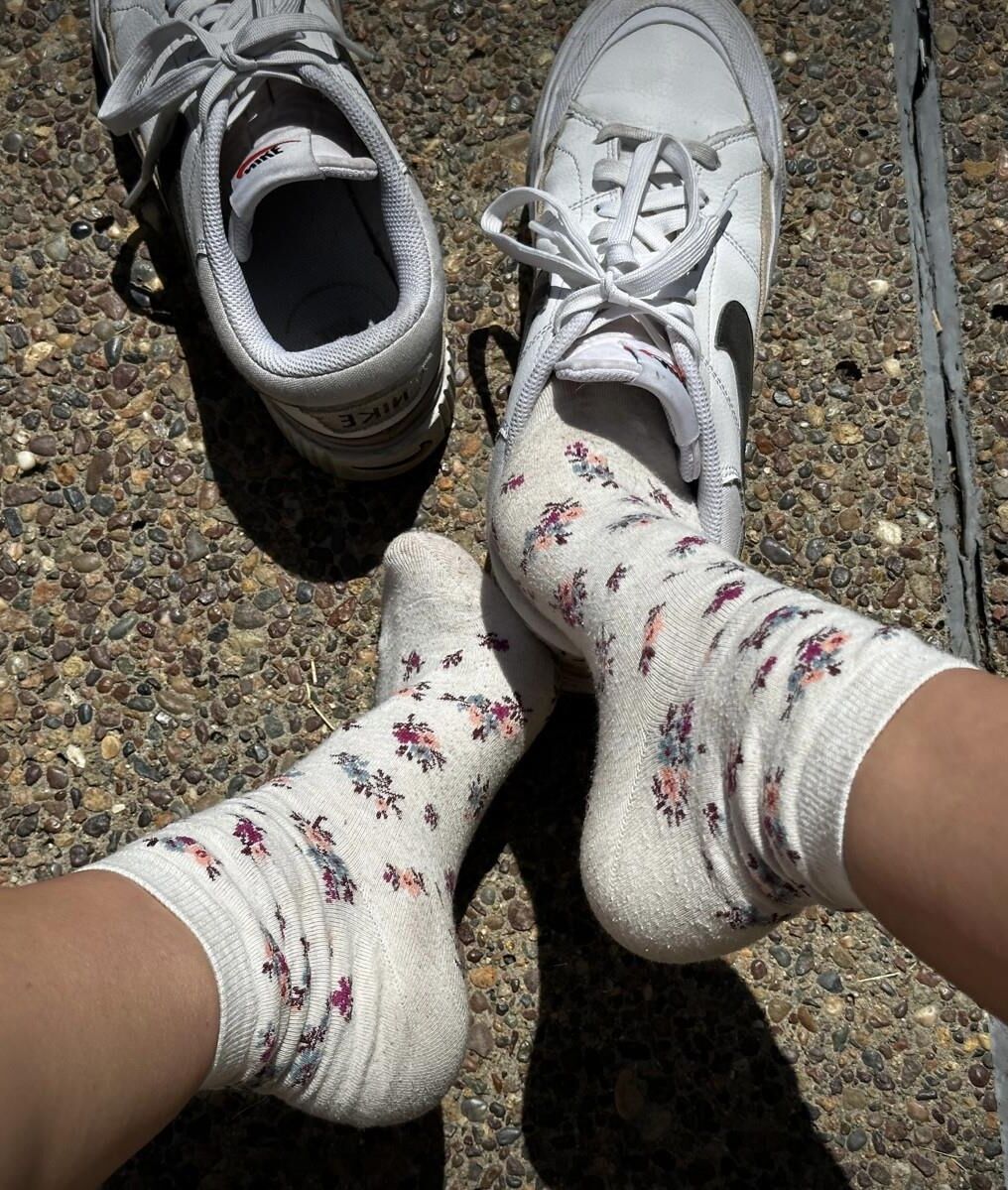 Kristin removes shoes and her sweaty, dirty socks