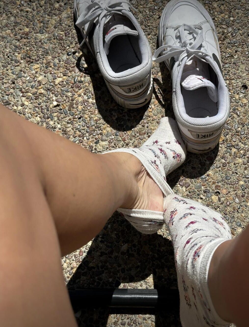 Kristin removes shoes and her sweaty, dirty socks