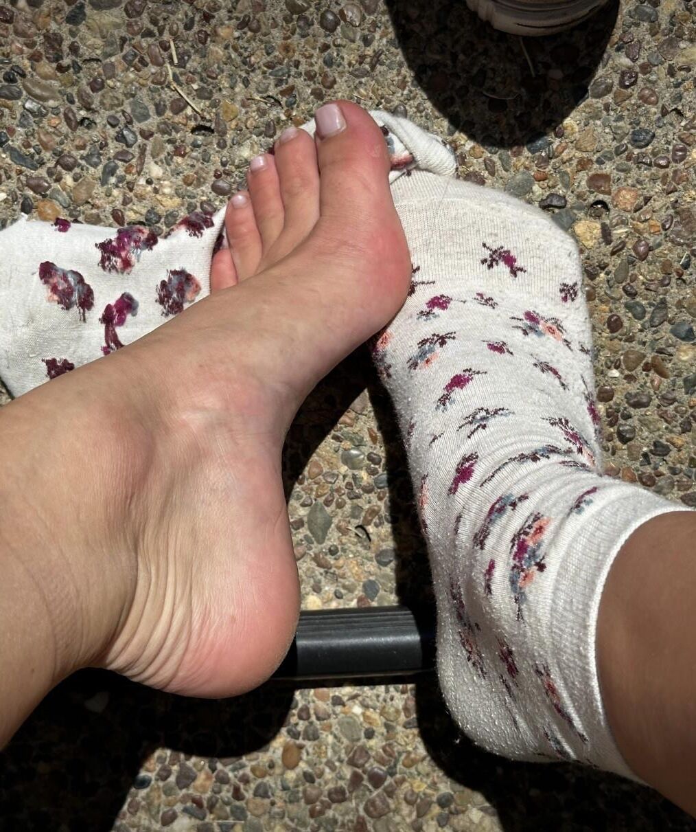 Kristin removes shoes and her sweaty, dirty socks