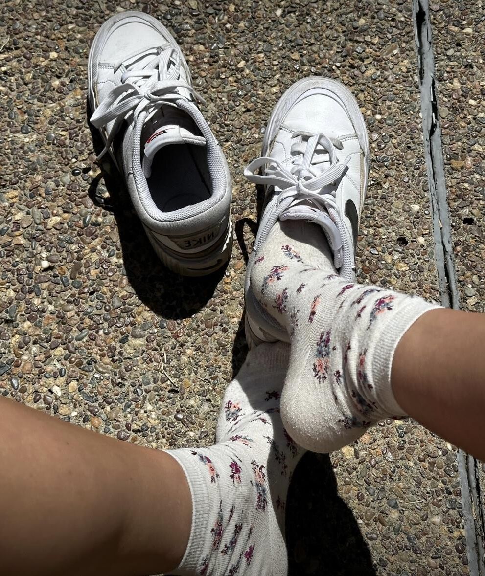 Kristin removes shoes and her sweaty, dirty socks