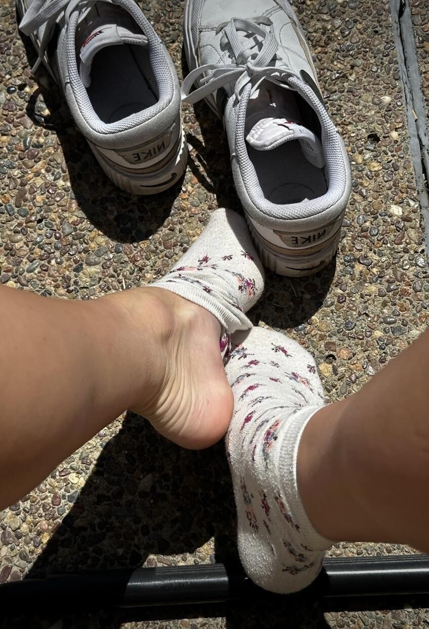 Kristin removes shoes and her sweaty, dirty socks