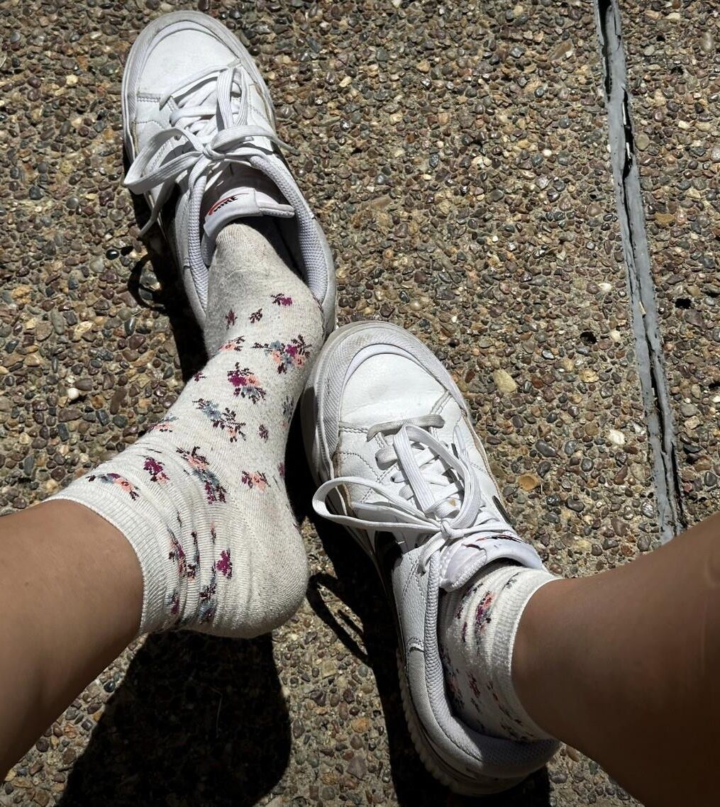 Kristin removes shoes and her sweaty, dirty socks
