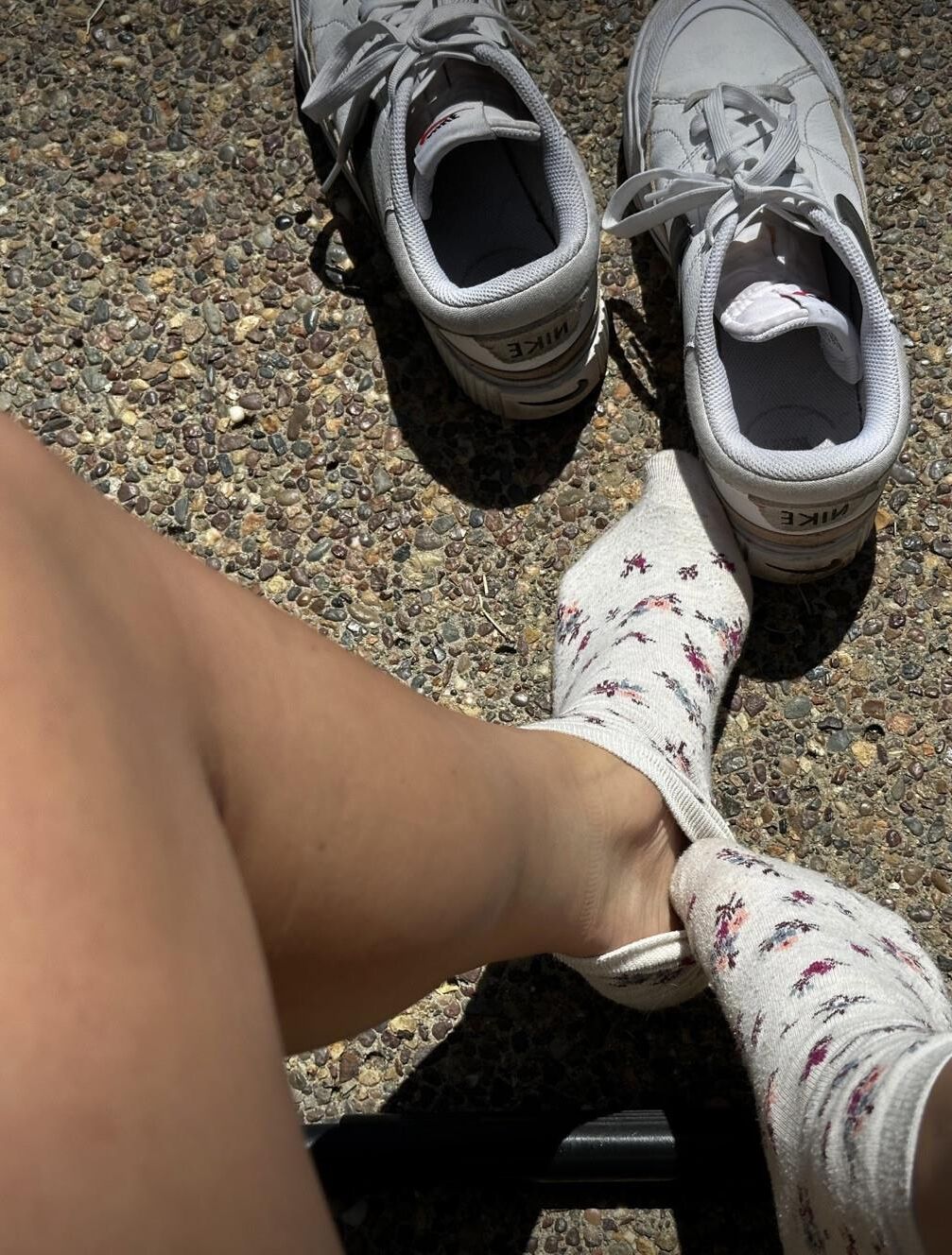Kristin removes shoes and her sweaty, dirty socks