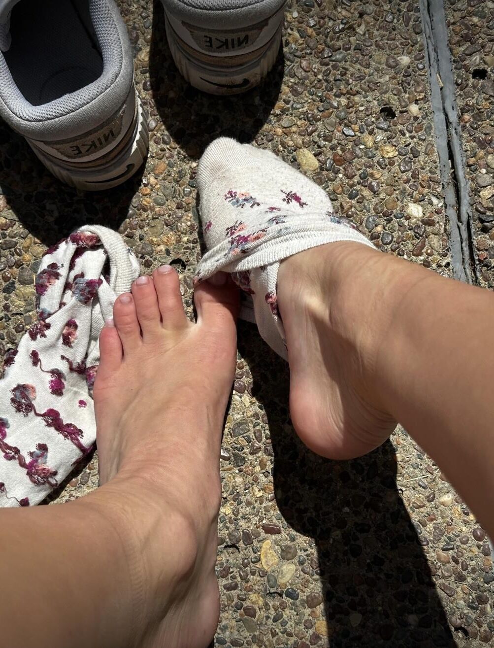 Kristin removes shoes and her sweaty, dirty socks