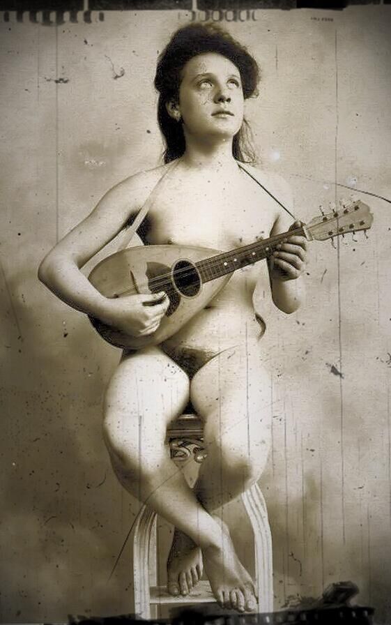 Music is nude, sensual women playing an instrument ()