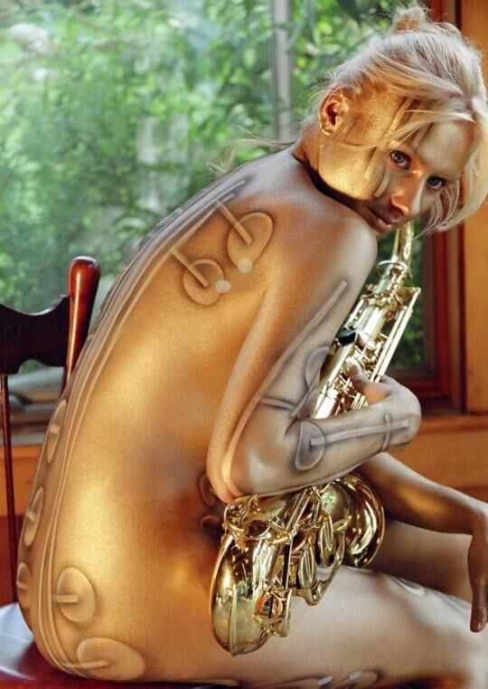 Music is nude, sensual women playing an instrument ()