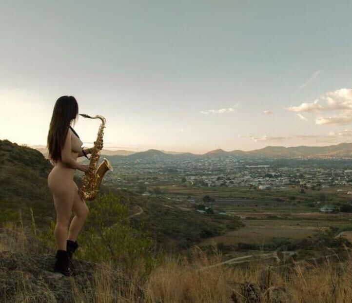 Music is nude, sensual women playing an instrument ()