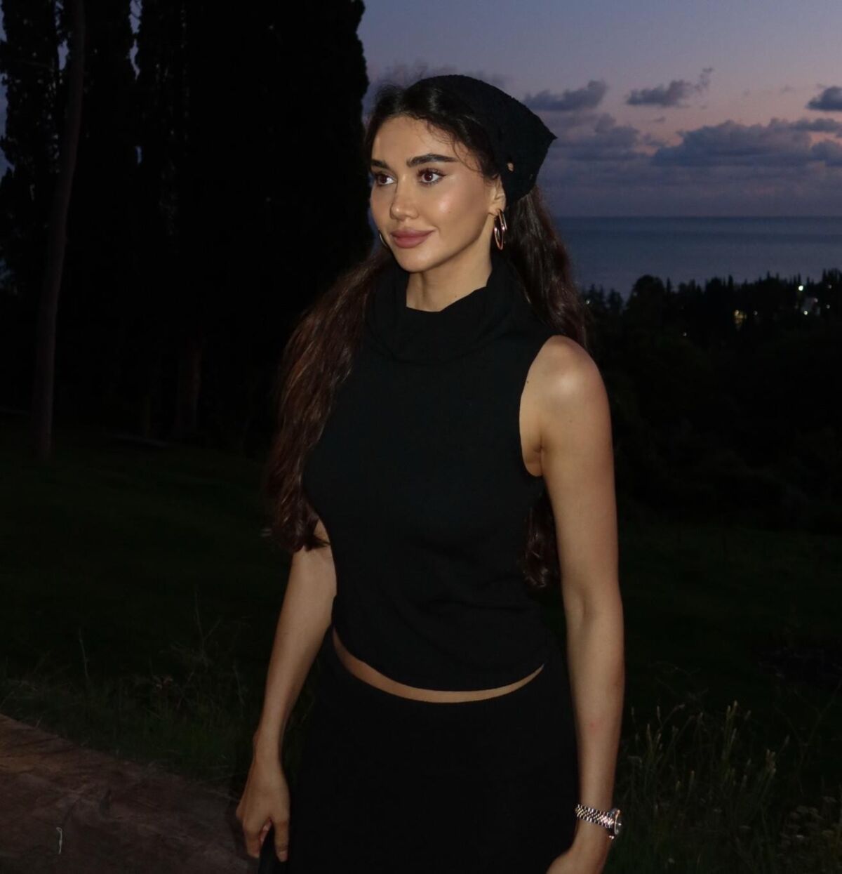 Black sleeveless tops and metal wristwatches #