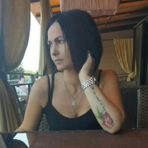 Black sleeveless tops and metal wristwatches #