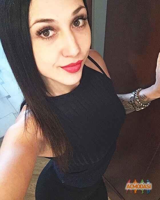 Black sleeveless tops and metal wristwatches #