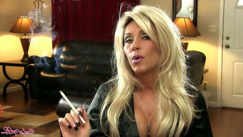 Busty MILF Smokes