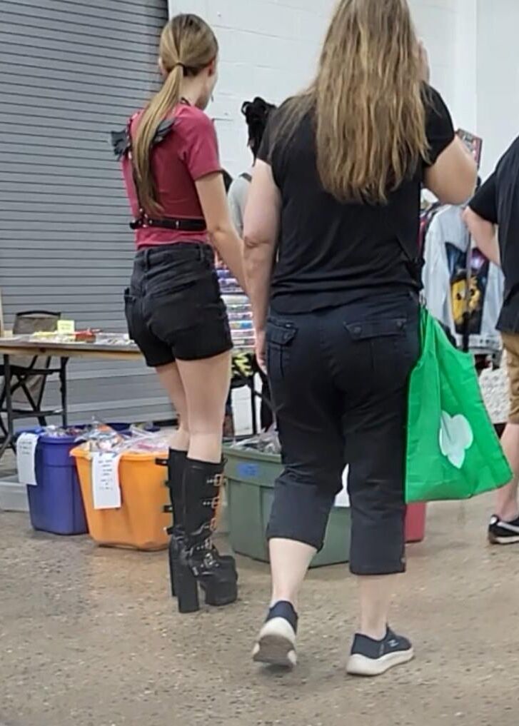 Public slut wears leather hooker boots and BDSM gear (CANDID)